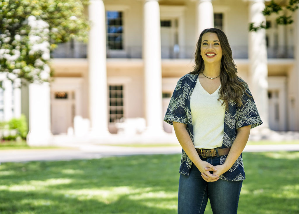 Student in front of Founders Hall