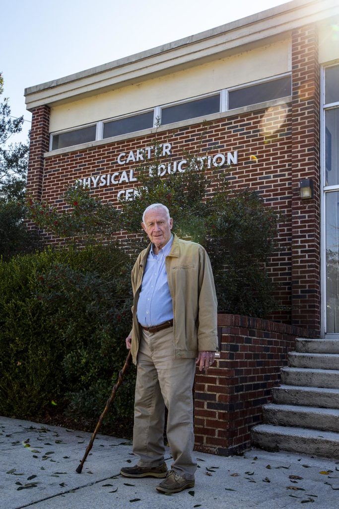 Rep Carter in front of Carter Gymnasium
