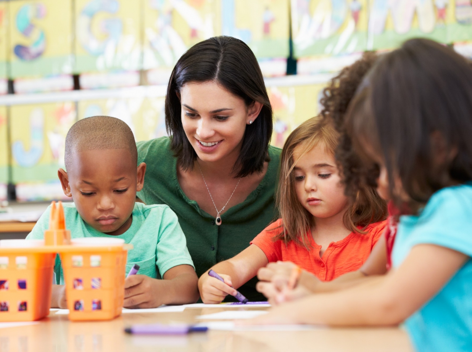 teacher with young students