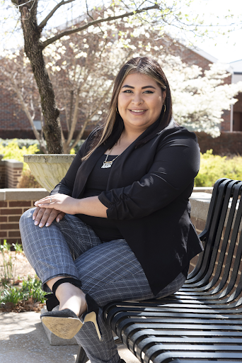 Morelia Tinajero sitting on campus bench