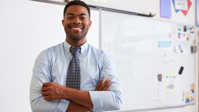 Young black male teacher in the classroom