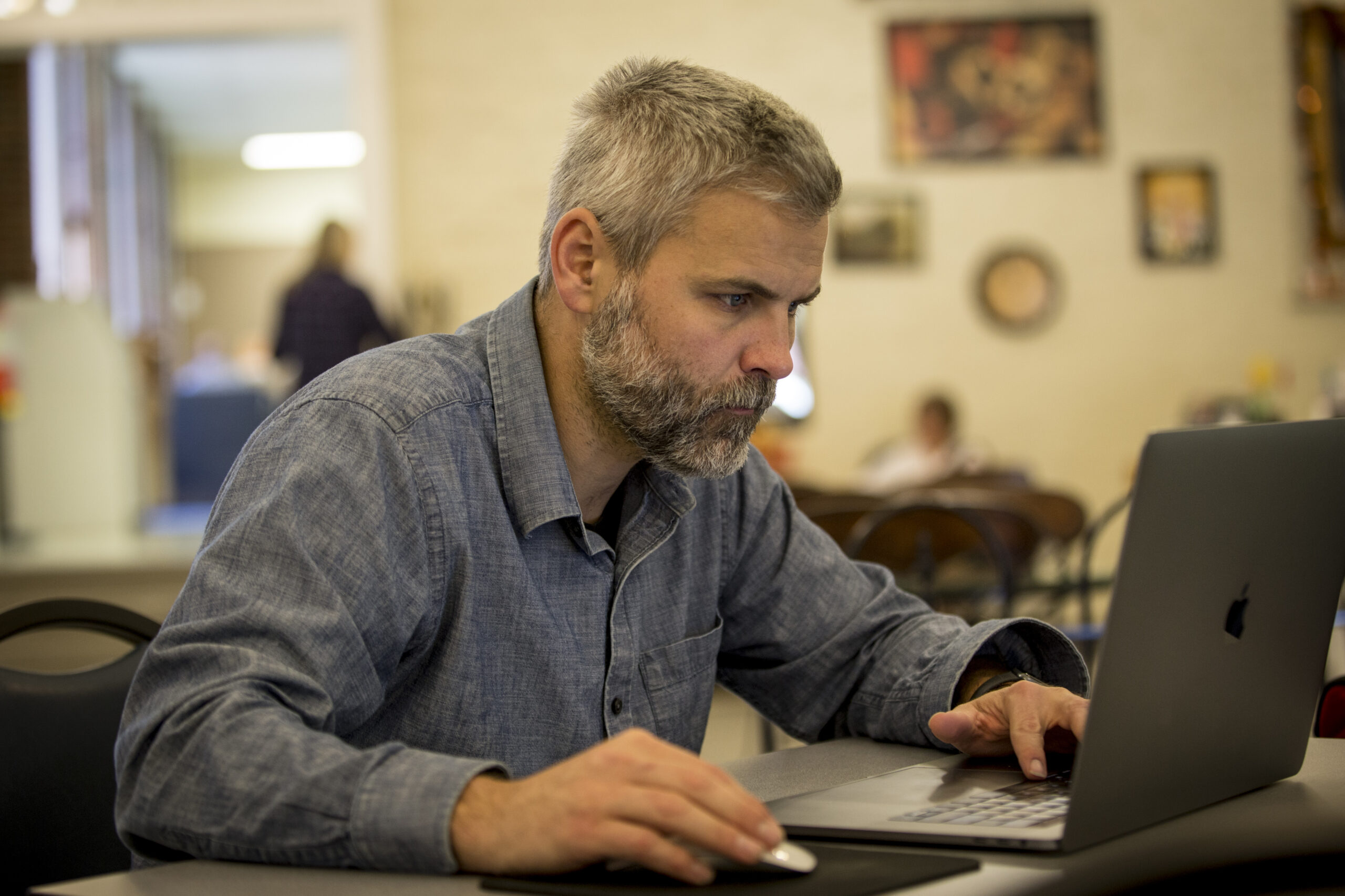 Mature student working on laptop