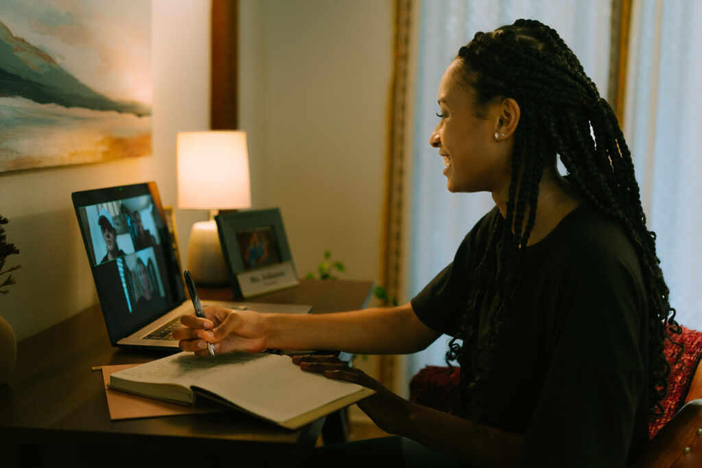 Student completes work while on videoconference