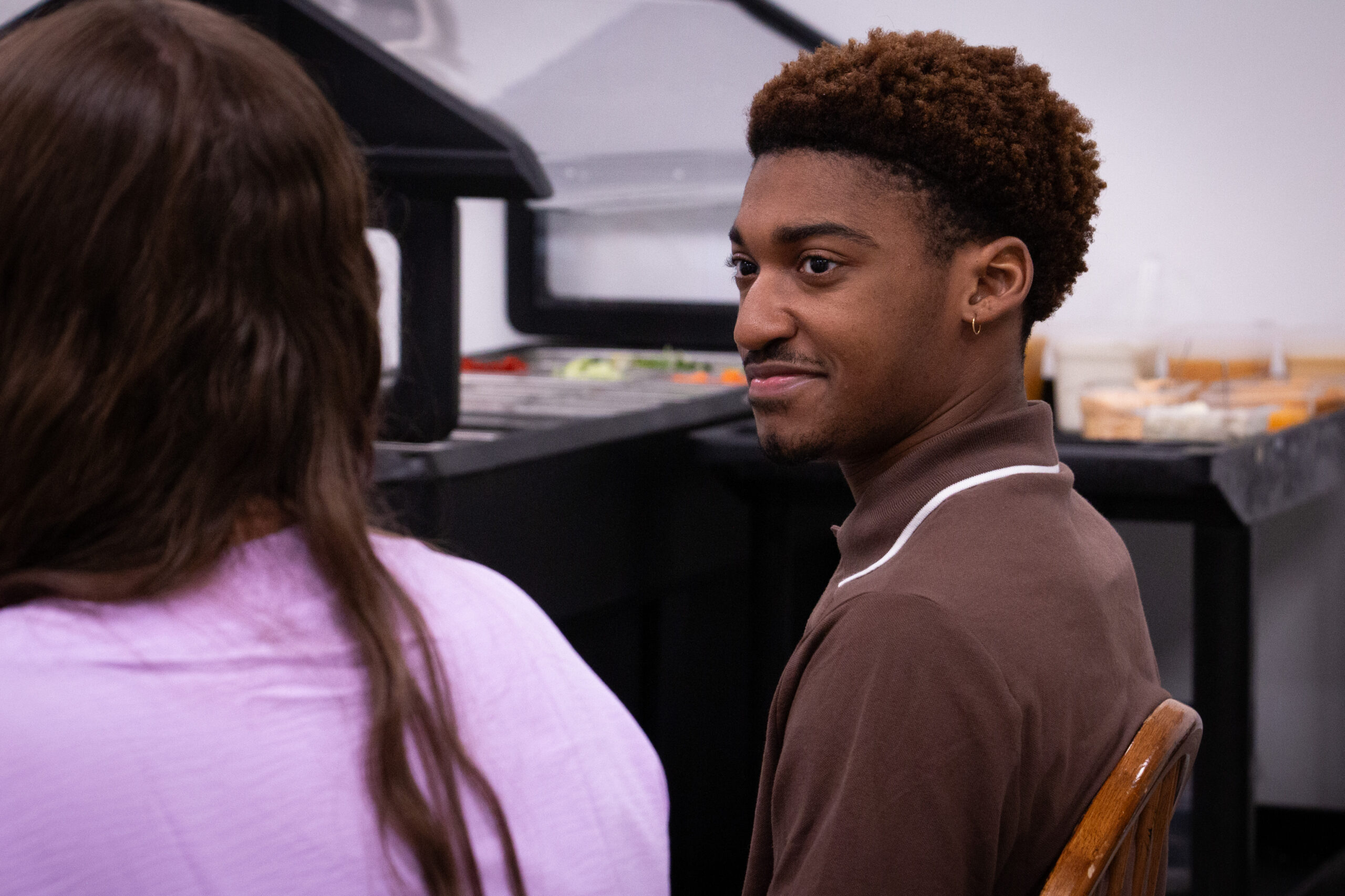 Students talking in campus café close-up