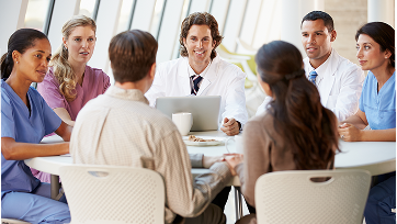 Medical professionals at conference table
